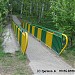 Пешеходный мост через заболоченный овраг в городе Москва