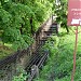 Зарешеченный верхний ступенчатый водосброс на Головинском канале в городе Москва