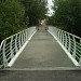 Арочный пешеходный мост через реку Раменку в городе Москва