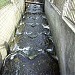 Зарешеченный верхний ступенчатый водосброс на Головинском канале в городе Москва
