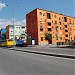 Orange building with red balls in Tirana city