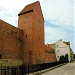 Reconstructed fragment of the city wall and Ramer tower on Torņa street