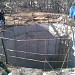 Засыпанный колодец большого размера в городе Москва
