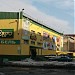 Магазин «Стройград» (вход) и другие магазины в городе Норильск