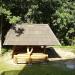 Wooden summerhouse with a swing