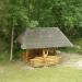 Wooden summerhouse with a swing