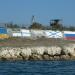 Images of ukrainian and russian flags in Sevastopol city