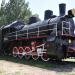 Old steam locomotive with museum in a carriage. in Melitopol city