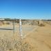 PCT turns right to follow dirt road around unnamed mountain