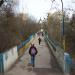 Пішохідний міст над алеєю парку «Погулянка» в місті Львів