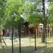 Огороженная территория с детской площадкой в городе Лиепая
