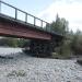 Ruined automobile bridge over Ayakit river