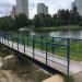 Пешеходный мост через водосток Школьного пруда в городе Москва