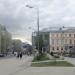 Фонарный столб с уличными часами в городе Москва