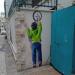 Boy with 9 O'Clock mural (en) في ميدنة الناصرة 