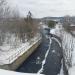 Сток воды с плотины в городе Сысерть