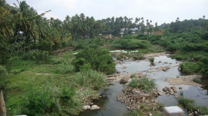 Rugged river-bed between road and rail line