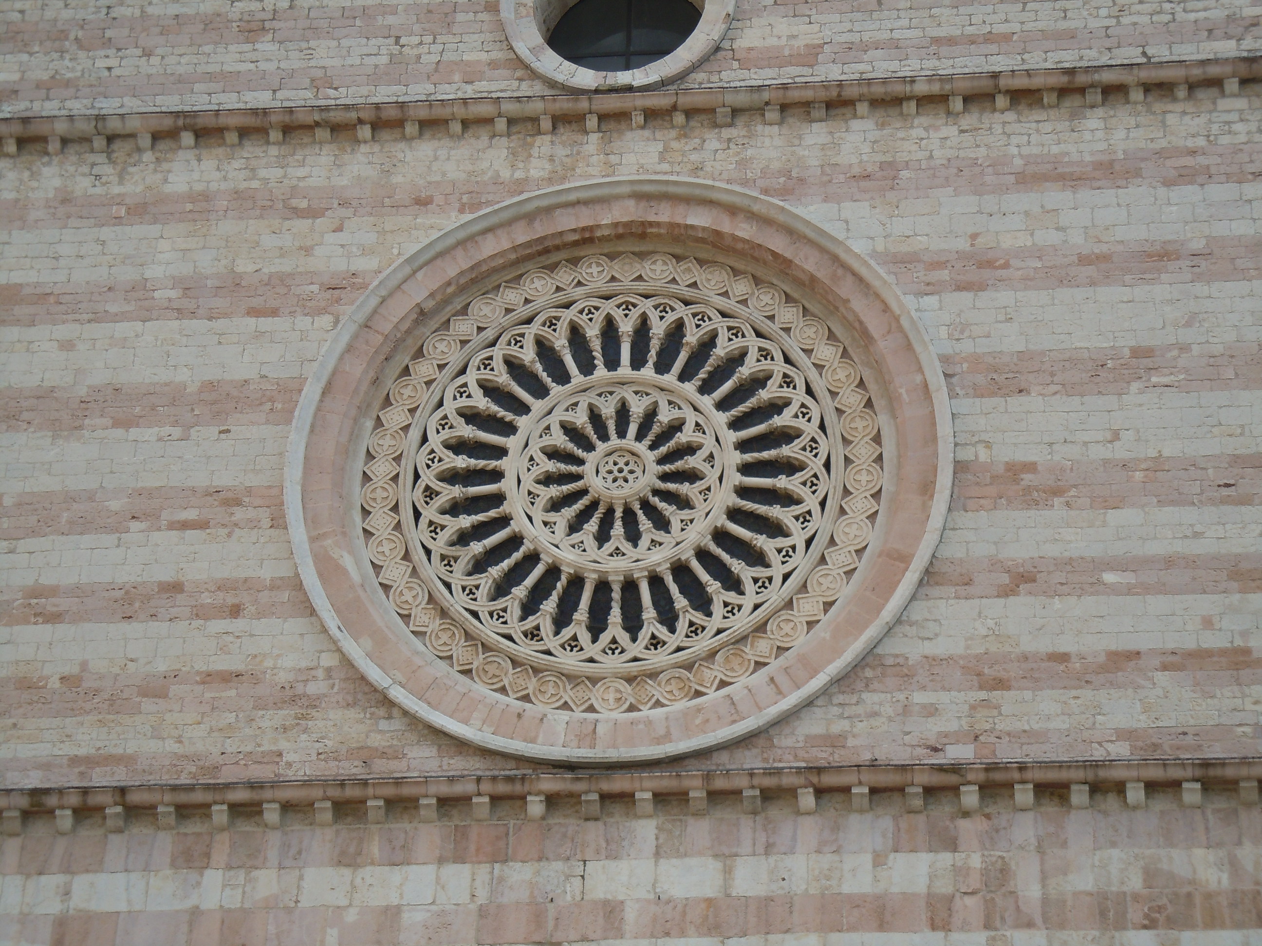 Rose window of the Basilica of Santa Chiara - Assisi, Italy ...